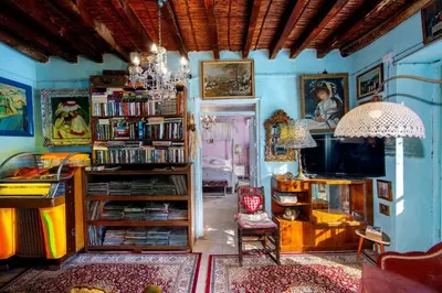 a living room filled with furniture and a tv at Tina's Country Home in Askas