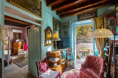 a living room with a couch and a chair at Tina's Country Home in Askas