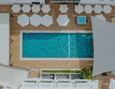an overhead view of a swimming pool with chairs at Cosmo Napa Boutique Hotel in Ayia Napa