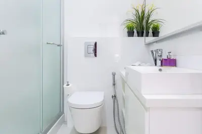 a bathroom with a toilet and a sink and a shower at Carmencita Studio B14 with pool in Limassol