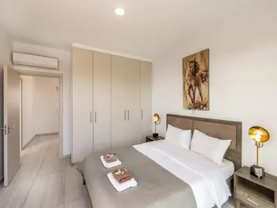 a bedroom with a large bed with a tray on it at Villa Zoe in Protaras