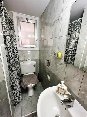 a small bathroom with a sink and a toilet at Youthfull Escape in Nicosia in Nicosia