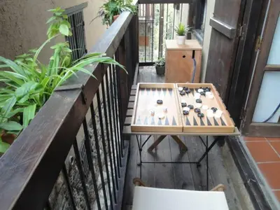 a game of dominoes on a balcony at Irene's House in Kakopetria