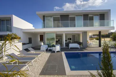 a villa with a swimming pool in front of it at Protaras Olivine Pearl in Protaras