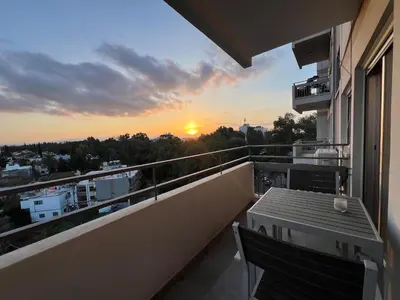 a balcony with a view of the sunset at River View Apartment in center Nicosia in Nicosia