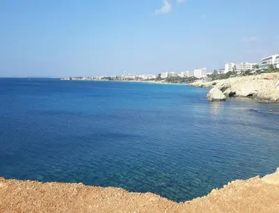 a large body of water with buildings in the background at Ayia Napa Sun Central in Ayia Napa