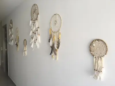 a group of clocks hanging on a wall at ElleNapa Apts & Studios in Ayia Napa