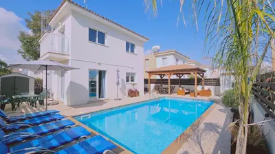 a villa with a swimming pool and a house at STAY Villa Anemone in Protaras