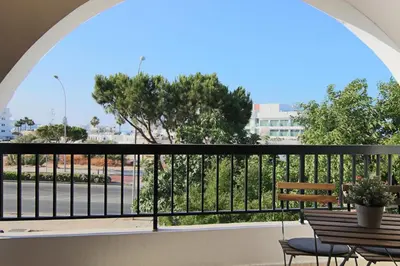 a balcony with a view of a street at Phaedrus Living Luxury Flat Protaras Sea View 9 in Protaras