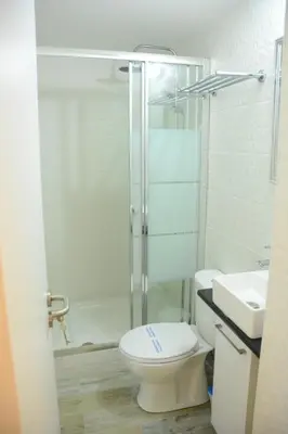 a bathroom with a shower and a toilet and a sink at Lazaros Stonehouse in Pano Lefkara