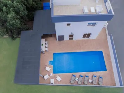 an aerial view of a house with a swimming pool at Villa Ruby Nissi Beach in Ayia Napa