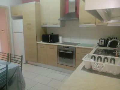 a kitchen with a sink and a stove top oven at 3 Bedroom Apartment in Nicosia