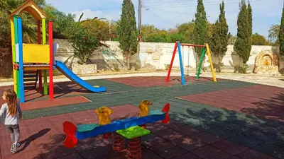 a little girl is playing on a playground at Holidays in Cyprus in Ayia Napa