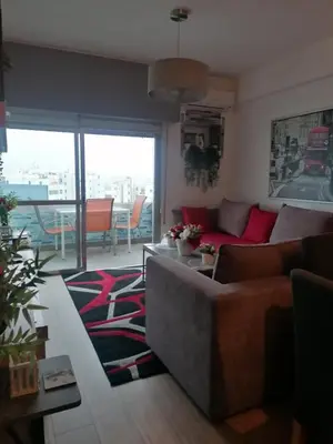 a living room with a couch and a table at Amazing Sea Place in Limassol
