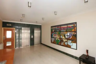 a room with a large painting on the wall at Klimentos Flat 58 in Nicosia