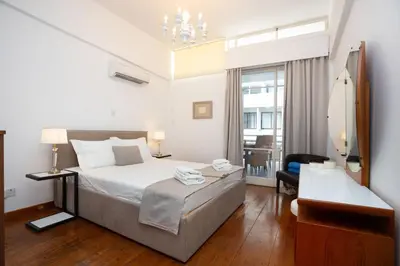 a hotel room with a bed and a mirror at 1-80 Collection by TrulyCyprus in Limassol