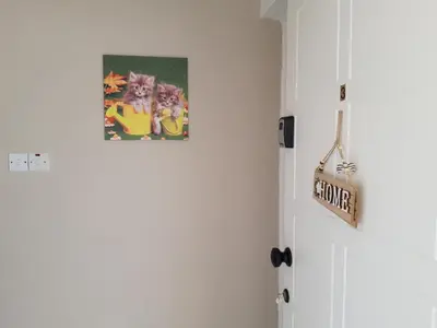 a room with a white door with a picture on the wall at La Veranda Sea View apartments in Larnaka