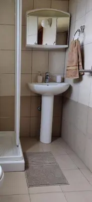 a bathroom with a sink and a mirror at Το Σπίτι του Προκόπη in Nicosia