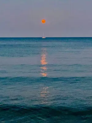 an orange object in the middle of the ocean at Kareem flat in Larnaka