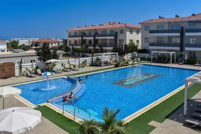 an overhead view of a swimming pool in a hotel at Mythical Sands Resort in Protaras