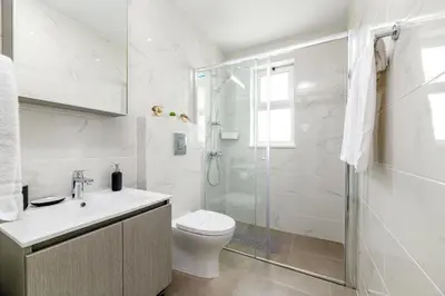 a white bathroom with a toilet and a shower at Mylos Lifestyle Seaview Villa #21 in Protaras