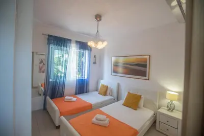 a small room with two beds and a couch at Sunrise Villa 12 in Ayia Napa