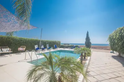 a swimming pool with a view of the ocean at Sunrise Villa 12 in Ayia Napa