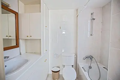 a bathroom with a toilet and a tub and a sink at Villa Mavris - Lovely 4 Bedroom Villa With Private Pool In Central Ayia Napa in Ayia Napa