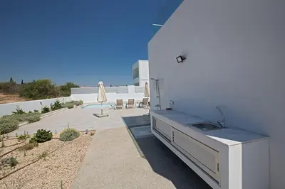 a kitchen with a sink in the side of a building at Villa Ochosto Eos - Luxury 5 Bedroom Protaras Villa With Private Pool - Close in Protaras
