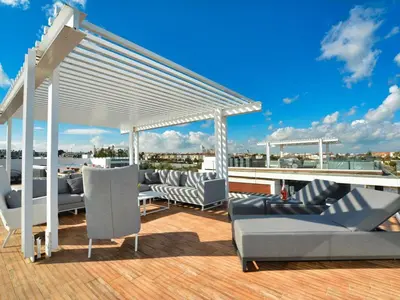 a deck with couches and a pavilion on a roof at Villa Limni Dyo - Luxurious Contemporary 3 Bedroom Villa With Sea Views And Hot in Paralimni