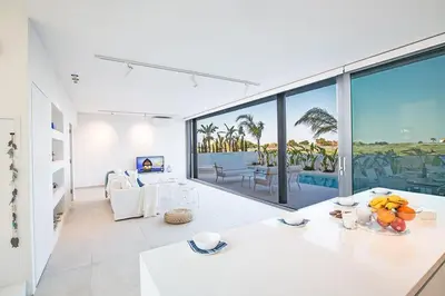 a living room with a view of the ocean at Villa Limni Enas - Luxury And Contemporary 3 Bedroom Kapparis Villa With Sea View in Paralimni