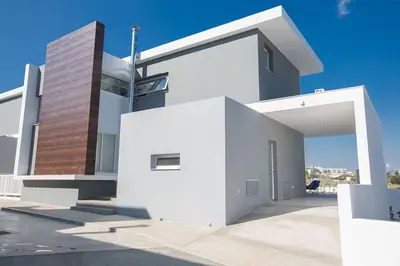 a white house with a white wall at Villa Olive Titan, Brand New,Exquisite 5Bdr Protaras Villa With Pool in Protaras