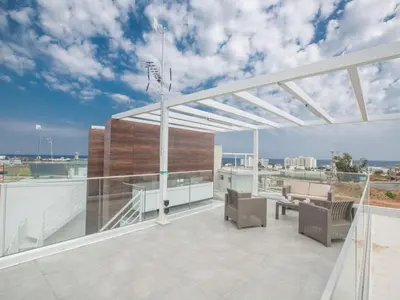a patio with a basketball hoop on a roof at Villa Olive Bronze, Luxurious 2Bdr With Pool, Close To Protaras Strip And Beach in Protaras