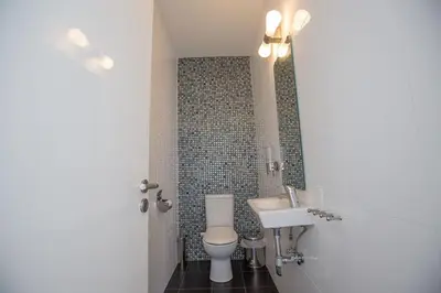 a bathroom with a toilet and a sink at Villa Protara Chrysos - Beautiful 5 Bedroom Protaras Villa - Walking Distance in Protaras