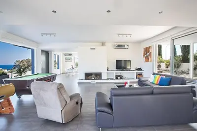 a living room with couches and a pool table at Villa Kono Sunshine - Luxury 4 Bedroom Cape Greco - Villa Close To Beach in Protaras