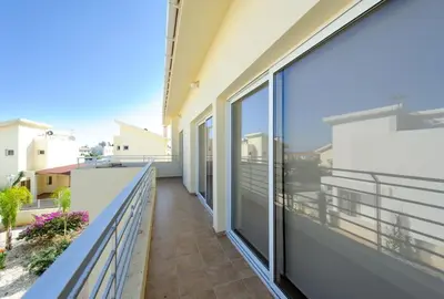 a balcony with sliding glass doors on a building at Villa Dafnis Helios - Lovely 3 Bedroom Central Protaras Villa With Pool in Protaras