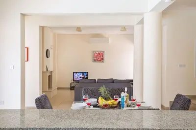 a table with fruit on it in a living room at Central Protaras Villa 3 Bedrooms Private Pool Villa Dafnis Morfi in Protaras