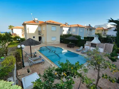an overhead view of a swimming pool in front of some buildings at Villa Oforo Selene - Stunning 4 Bedroom Villa - By Fig Tree Bay Beach - Sea View in Protaras