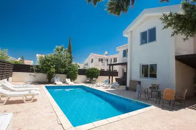 a swimming pool in the backyard of a house at Villa Protaras Eos, Modern 3Bdr Protaras Villa With Pool, Short Walk in Protaras