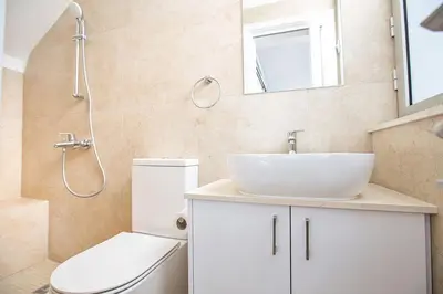 a bathroom with a sink and a toilet and a shower at Villa Olive Thalassa, Brand New, Luxury 3Bdr Protaras Villa With Private Pool in Protaras