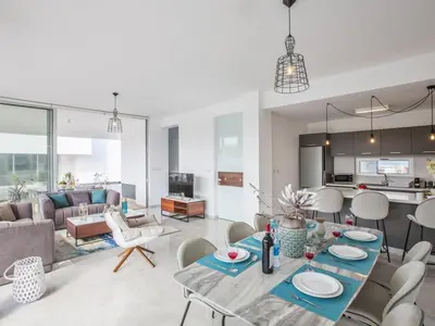 a living room with a table and chairs at Villa Olive Sun, Beautiful, Contemporary 3Bdr Villa With Private Pool in Protaras