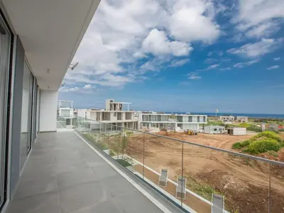a balcony with a view of a building at Villa Olive Platinum, New And Luxury 4Bdr Protaras Villa With Private Pool in Protaras