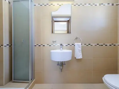 a bathroom with a sink and a shower at Villa Leoforos Dyo, Modern 3Bdr Protaras Villa With Pool, In The Centre in Protaras