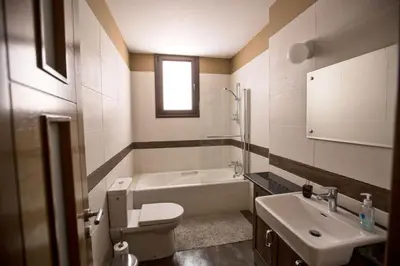 a bathroom with a sink and a toilet and a tub at Villa Protaras Deluxe, Fabulous And Luxurious 7Bdr Villa, Close To Fig Tree in Protaras