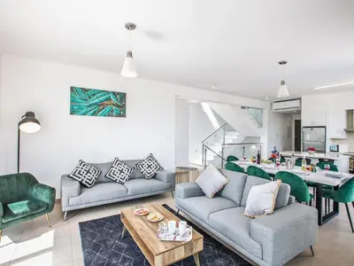 a living room with two couches and a table at Villa Protaras Gold,Brand New, Luxury 5Bdr Protaras Villa With Private Pool in Protaras