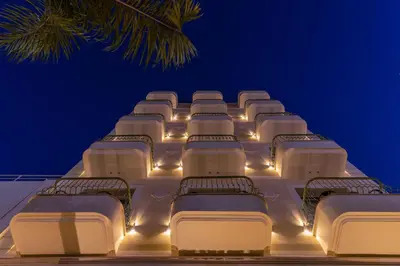 a row of beds on a cruise ship at night at Leonardo Boutique Hotel Larnaca in Larnaka