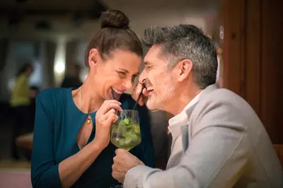 a man and a woman drinking from a wine glass at ROBINSON Cyprus in Alaminos