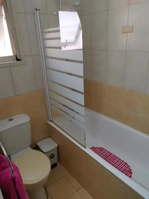 a bathroom with a toilet and a shower at Garden Luxury Apartment Ayia Napa in Ayia Napa