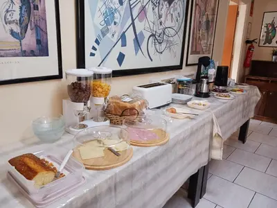 a white table with food on top of it at Denis Hotel in Nicosia