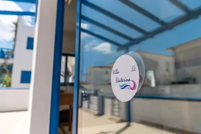 a window with a volleyball sign on it at St Nicolaos Villa Ekaterina 3 bdrm in Protaras